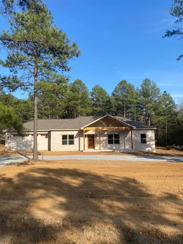 A newly built home on a freshly graded lot ready for hydroseed